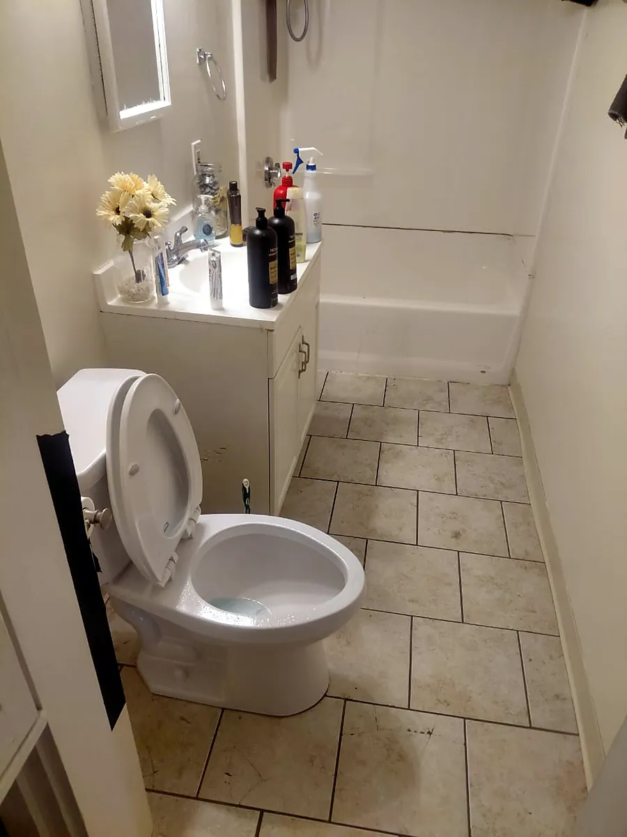 Clean bathroom tile floor in a Worcester apartment after a Bella Shine cleaning